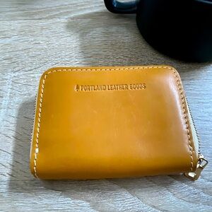 NWOT Portland leather sunflower color accordion zip wallet.